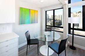San Francisco apartment for rent - a dining room with a glass table and black chairs