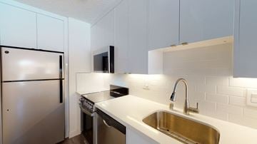 San Francisco apartment for rent - a kitchen with a sink and a refrigerator