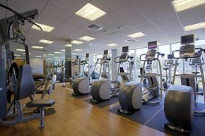 San Francisco apartment for rent - Luxury Apartments in San Francisco, CA for Rent - Trinity Place at 1188 - Fitness Center with Elliptical Machine and Floor-to-Ceiling Windows