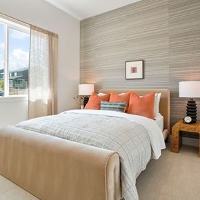 Littleton apartment for rent - A bedroom with a large bed and a window with curtains.