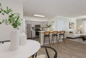 Wide-plank wood flooring throughout living, dining and kitchen areas*
