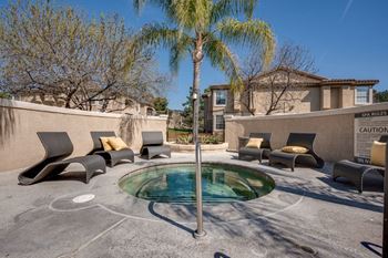 Resort-style pool, spa and outdoor lounge area