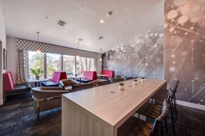Temecula apartment for rent - A conference room with a long table and chairs.