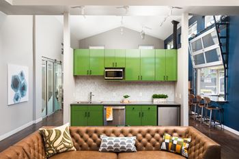 Newly constructed modern clubhouse with social seating, large flat screen tv, business center & coffee bar