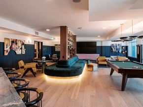 Denver apartment for rent - A room with a pool table and a bar area.
