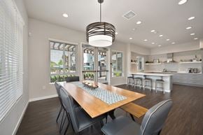 Chula Vista apartment for rent - A modern dining room with a wooden table and chairs.