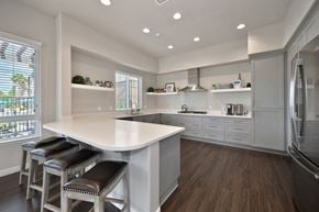 Chula Vista apartment for rent - A kitchen with a white counter and brown stools.