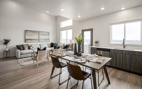 Bluffdale townhouse for rent - A modern dining room with a wooden table and chairs.
