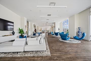Stamford apartment for rent - A living room with white furniture and a wooden floor.