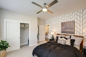 Parker apartment for rent - a bedroom with a large bed and a ceiling fan