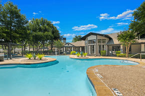 Arlington apartment for rent - A resort-style pool with views of a residential clubhouse at Bardin Greene best apartments in Arlington, TX.