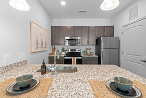 Concord apartment for rent - A kitchen with a granite countertop and a sink.