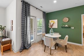 Concord apartment for rent - A dining room with a table set for four.