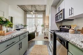 Phoenix apartment for rent - a kitchen with granite counter tops and a stove and a window