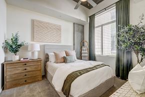 Phoenix apartment for rent - a bedroom with a bed and a large window