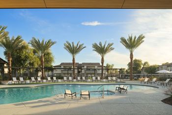 Swimming pool area with relaxing loungers