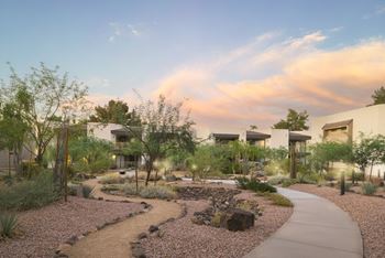 Lush landscaping with lawns throughout