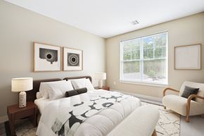 Westborough apartment for rent - A bedroom with a large bed and two lamps.