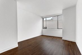 San Francisco apartment for rent - a bedroom with hardwood floors and a large window