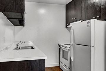 San Francisco apartment for rent - a kitchen with a sink and a refrigerator