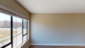 San Francisco apartment for rent - a bedroom with a large window and hardwood floors