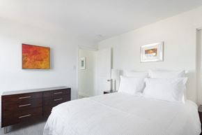 San Francisco apartment for rent - a bedroom with white walls and a large white bed