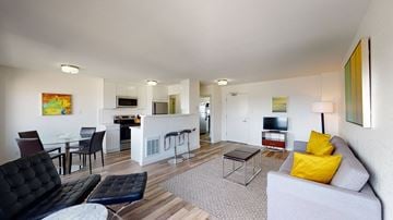 San Francisco apartment for rent - a living room with a couch and a table and a kitchen