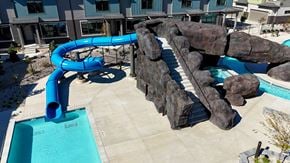 West Valley City townhouse for rent - Blue water slide in a pool at H2O Townhomes, Utah, 84119