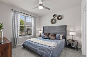 Aubrey apartment for rent - A bedroom with a window and large bed