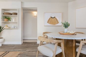 Wide plank hardwood-style flooring & plush carpeting *