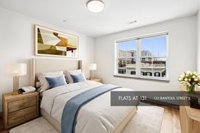 Beverly apartment for rent - A bedroom with a large bed and a view of the city.