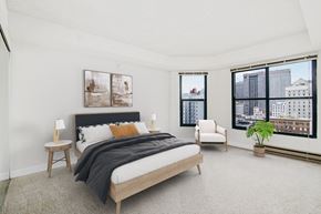 San Francisco apartment for rent - a bedroom with a bed and a large window