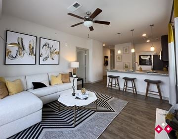 Lebanon apartment for rent - a living room with a couch and a coffee table in front of a kitchen
