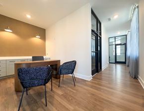 Savannah apartment for rent - Leasing office with wooden table and chairs and windows