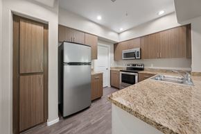 Phoenix apartment for rent - a kitchen with granite counter tops and stainless steel appliances
