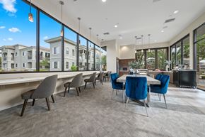 Phoenix apartment for rent - a dining room with a table and chairs and a large window