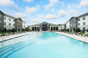 Charlotte apartment for rent - A large swimming pool in front of apartment buildings.