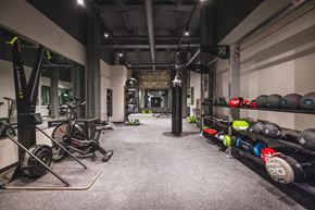 Philadelphia apartment for rent - A gym with a variety of equipment including weights and a rowing machine.