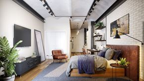Philadelphia apartment for rent - A bedroom with a bed, chair, and potted plant.