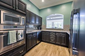 Morrisville apartment for rent - Kitchen with brown cabinets at The Lex at Brier Creek, Morrisville, North Carolina