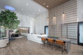 Anaheim apartment for rent - A modern dining area with a long table and chairs.