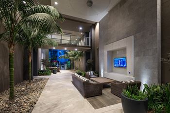 Open-air loggia with large screen tv's and cozy seating areas