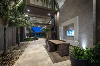 Open-air loggia with large screen tv's and cozy seating areas