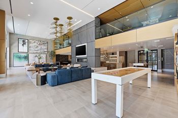 Game lounge with billiards table, shuffle board & flat screen tvs
