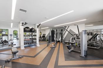24-Hour fitness club with state-of-the-art fitness equipment including free weights