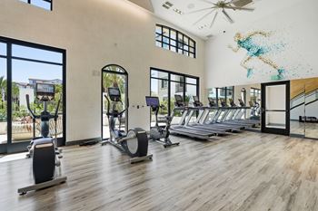 24-Hour fitness club with state-of-the-art fitness equipment including free weights
