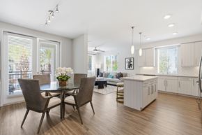 San Diego apartment for rent - A modern dining room with a glass table and chairs.