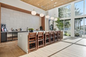 Chula Vista apartment for rent - A kitchen with a long wooden table and chairs.