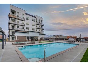 South Salt Lake City apartment for rent - a swimming pool in front of a building