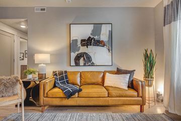 West Haven apartment for rent - a living room with a couch and a painting on the wall